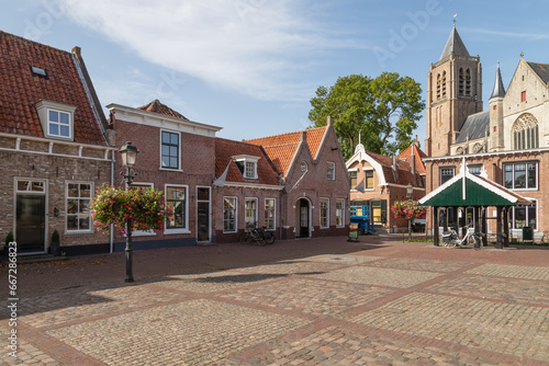 Market square with the medieval Church of Our Lady in the background in the center of the city of Tholen in the province of Zeeland. photo