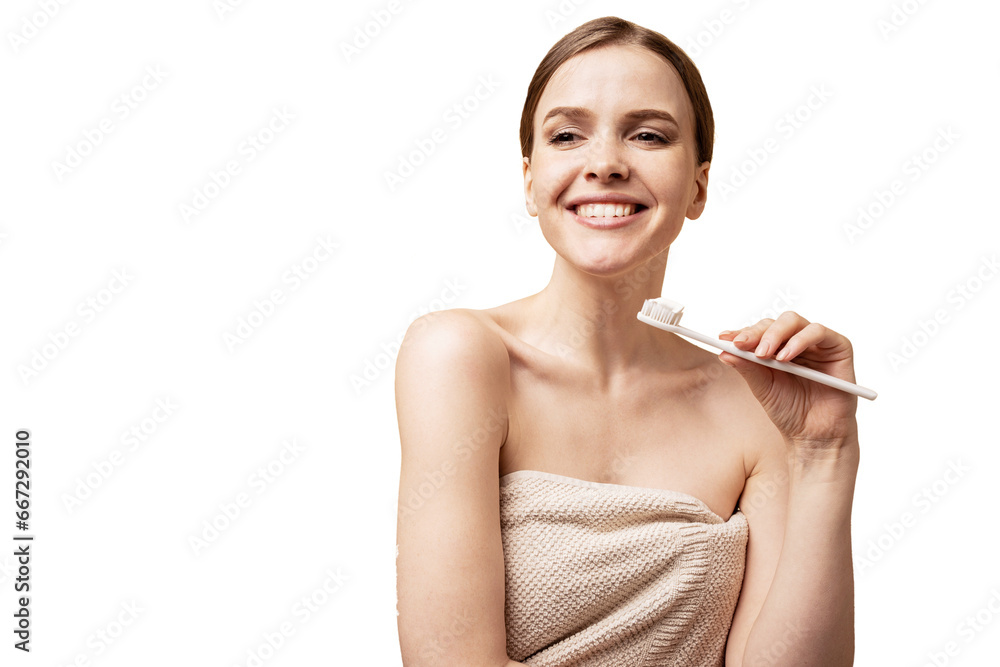 Uses a toothbrush and toothpaste in the morning smiling. A young woman takes care of herself and her skin, taking care of the body after a spa procedure. Uses a toothbrush and toothpaste in the morning smiling. A young woman takes care of herself and her skin, taking care of the body after a spa procedure.