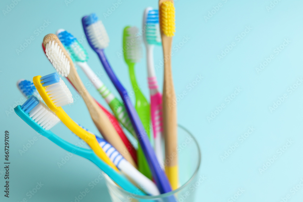 Different toothbrushes on a colored background. Dental care, oral health. Different toothbrushes on a colored background. Dental care, oral health.