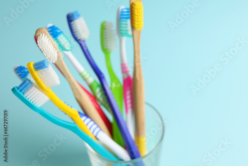 Different toothbrushes on a colored background. Dental care  oral health.