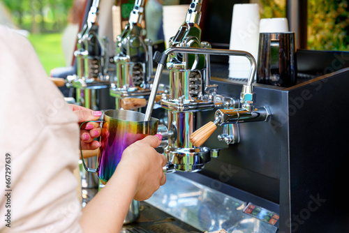 Barista Making Tasty Coffee on a Professional Machine Installed in the Backside of a Minivan  Food Service  Best Coffee  and Events Outdoors