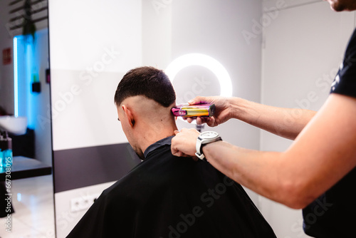 Barber's precision trim with electric clipper.
