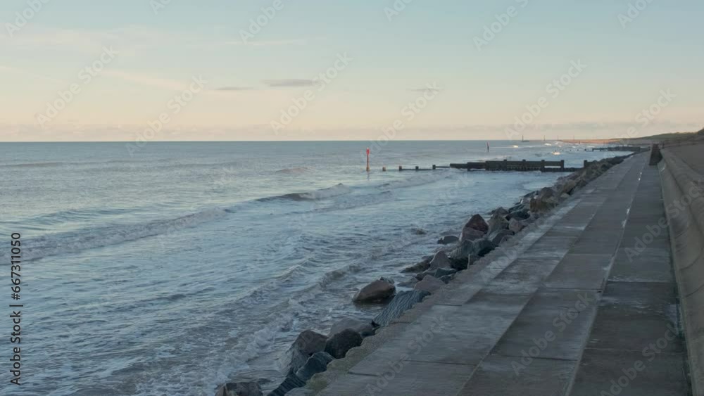 Hightide at the coast during late afternoon. Captured at Cart Gap beach on the North Norfolk Coast Hightide at the coast during late afternoon. Captured at Cart Gap beach on the North Norfolk Coast