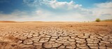 Drought and climate change lead to cracked and dry soil revealing water shortage and climate crisis