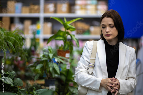 Wallpaper Mural woman in a houseplant store chooses Torontodigital.ca