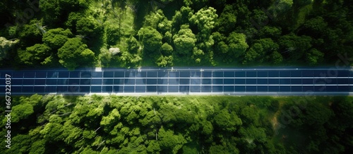 Bird s eye perspective of solar panel and road photo