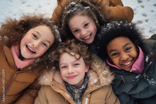 A group of children laying on top of each other in the snow.