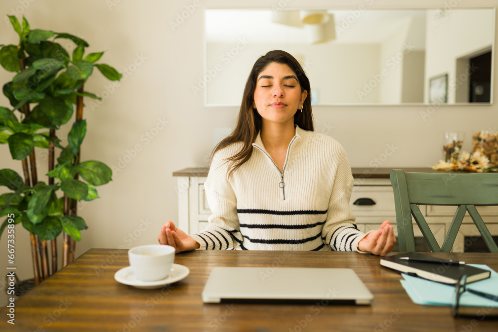 Beautiful woman practicing mindfulness meditation at home Beautiful woman practicing mindfulness meditation at home