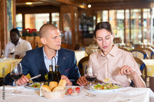 Young american couple celebrating anniversary drinking wine in restaurant © JackF