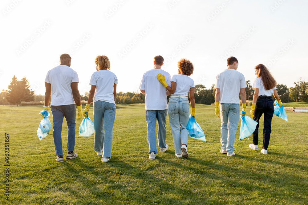 multiracial group of people volunteers in gloves with garbage bags collect garbage and plastic in the park multiracial group of people volunteers in gloves with garbage bags collect garbage and plastic in the park
