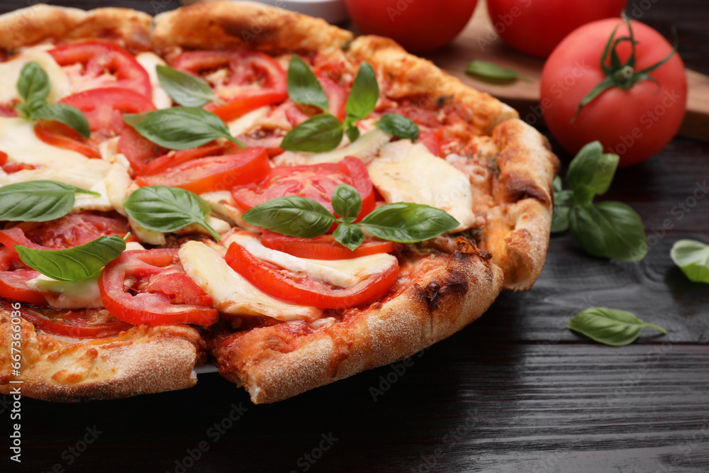 Delicious Caprese pizza on wooden table, closeup Delicious Caprese pizza on wooden table, closeup