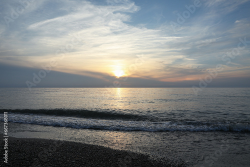 Picturesque view of sea and tropical beach at sunset