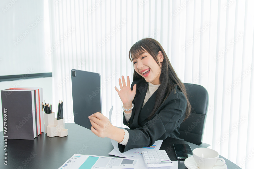 business woman working on the tablet ,discussing customer and checking business analytic document report working place in office. business woman working on the tablet ,discussing customer and checking business analytic document report working place in office.