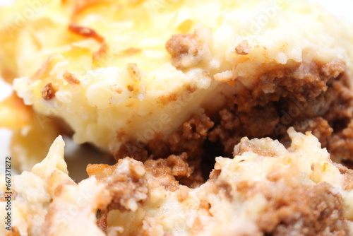 close up of minced meat in the meal.close up of minced meat in the meal. prepared food known as Madalena. meal made with mashed potatoes and ground meat. meal with selective focus. meal details. photo