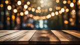 Empty wooden table in front of abstract blurred festive background with light spots and bokeh for product montage display of product