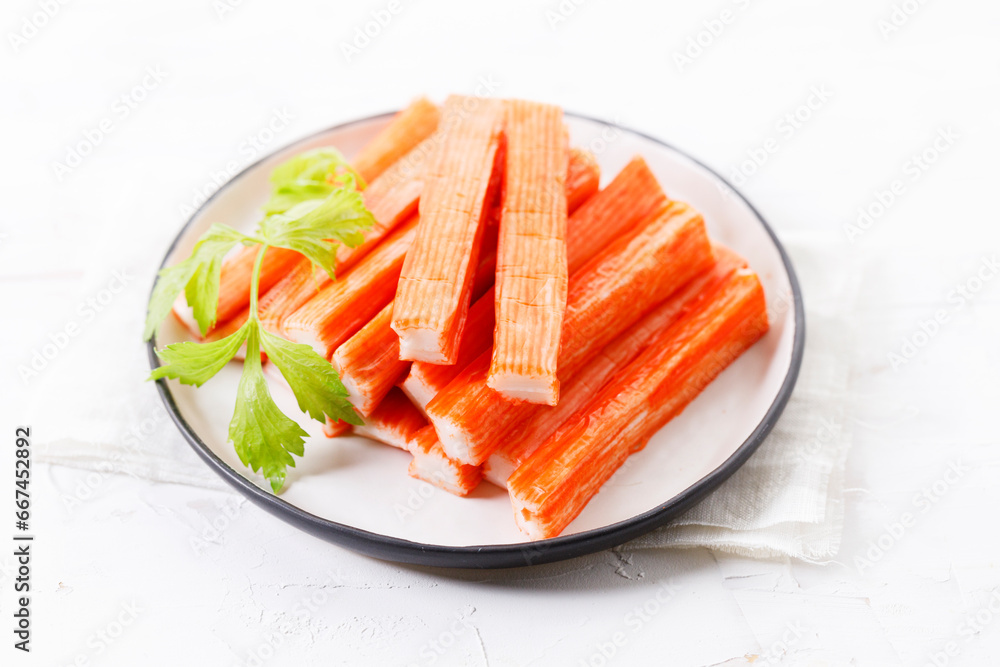 Crab sticks on white plate. Crab sticks on white plate.