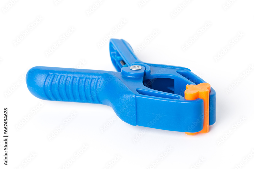Blue plastic clamp on white background. Plastic clip, front view. Blue plastic clamp on white background. Plastic clip, front view.