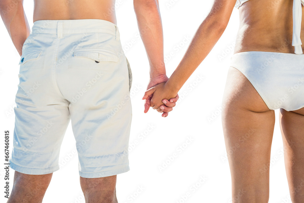 Digital png photo of caucasian couple in beachwear, holding hands on transparent background Digital png photo of caucasian couple in beachwear, holding hands on transparent background
