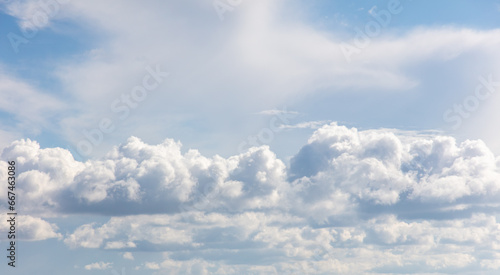 White clouds on a blue sky as a background