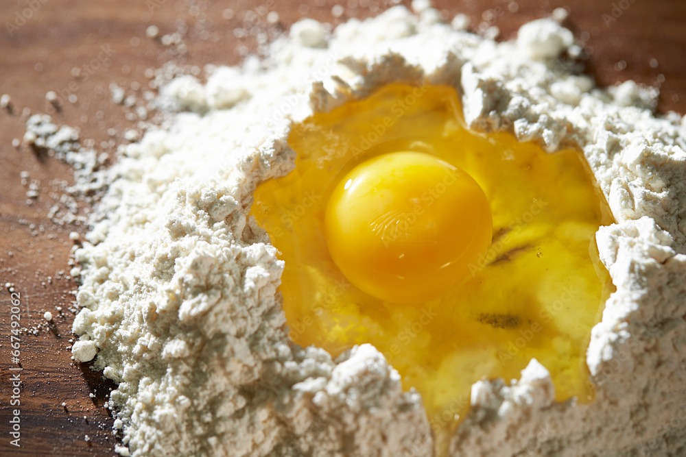 Yolk and flour on a cutting board Yolk and flour on a cutting board
