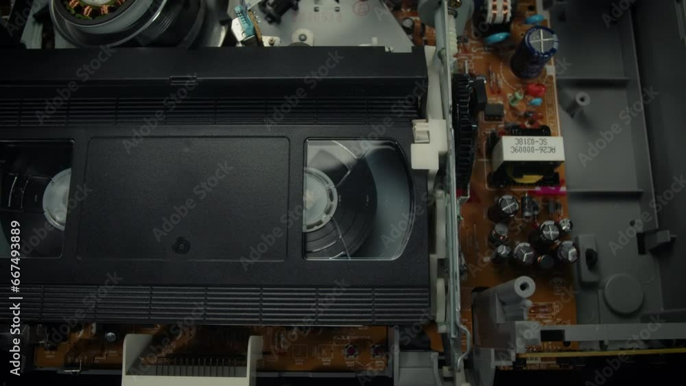 VHS Tape Playing in a VCR Dolly Reverse VHS Tape Playing in a VCR Dolly Reverse