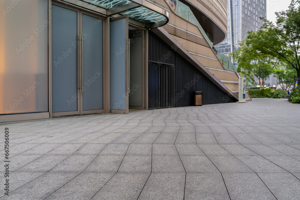 empty concrete floor in front of modern buildings in the downtown street. empty concrete floor in front of modern buildings in the downtown street.