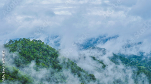 Fototapeta Naklejka Na Ścianę i Meble -  Doi Luang Chiang Dao mountain hills in Chiang Mai, Thailand. Nature landscape in travel trips and vacations. Doi Lhung Chiang Dao Viewpoint with clouds mist and fog during rain season