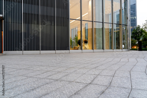 empty concrete floor in front of modern buildings in the downtown street.