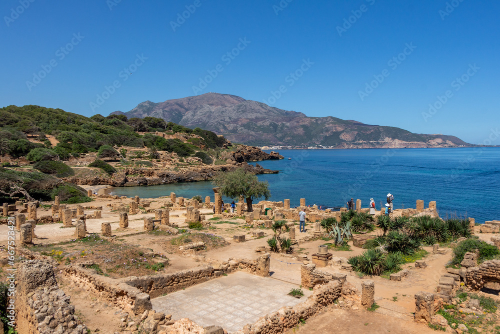 Ruins of the Roman Archeological Park of Tipaza ( Tipasa ), Algeria. Mount Chenoua and the Meditarranean sea in the background.