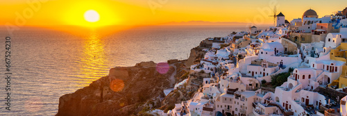 White churches and blue domes by the ocean of Oia Santorini Greece, a traditional Greek village in Santorini in the evening light at sunset