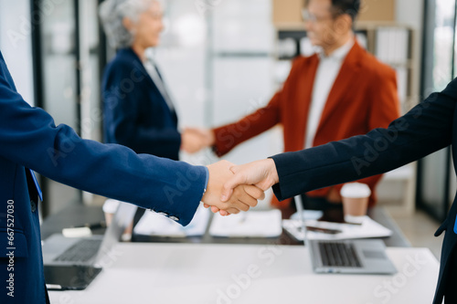 Business partnership handshake concept.Photo two coworkers handshaking process.Successful deal after great meeting. in office.