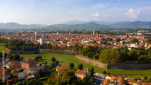 Fototapeta Naklejka Na Ścianę i Meble -  Aerial view of Lucca, Italy. It is a city and comune in Tuscany. The historic centre, full of ancient structures from various eras, is surrounded by sixteenth-century walls.