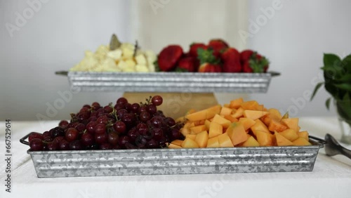 Fruit Platter with Grapes, Cantaloupe, Strawberries, and Pineapple on Table photo