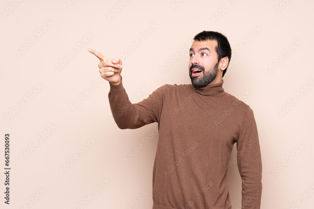 Man over isolated background pointing away Man over isolated background pointing away