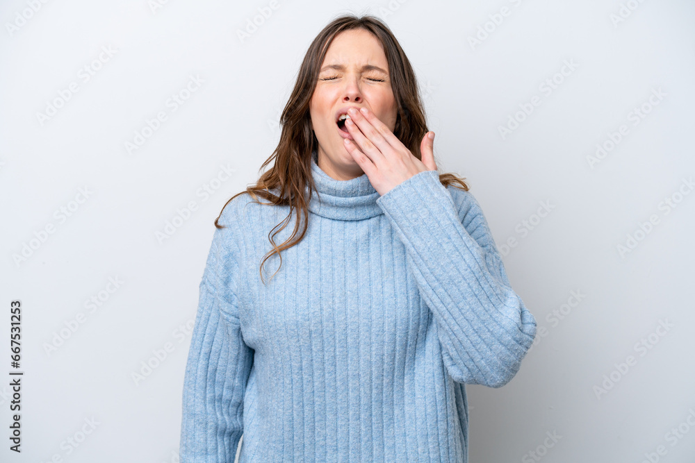 Young caucasian woman isolated on white background yawning and covering wide open mouth with hand Young caucasian woman isolated on white background yawning and covering wide open mouth with hand