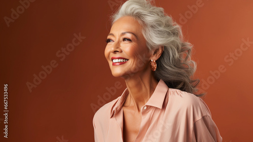 Happy and smiling attractive beauty caucasian senior woman, isolated on plain background studio portrait