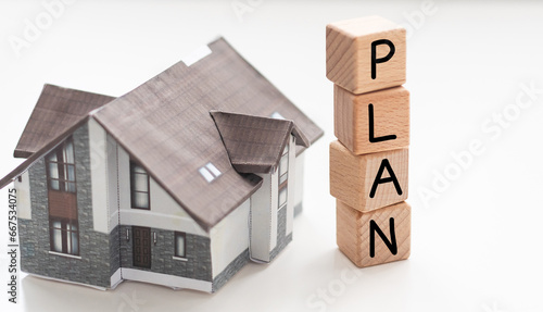 Real estate or property concepts with plan text and model house.business investment and financial.