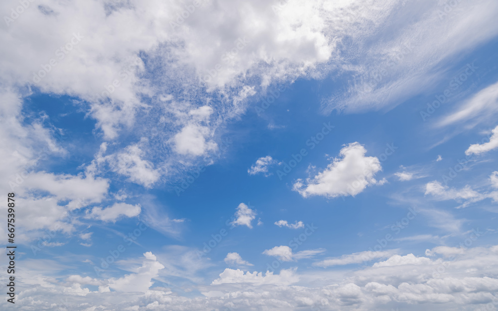Panoramic view of clear blue sky and clouds, Blue sky background with tiny clouds. White fluffy clouds in the blue sky. Captivating stock photo featuring the mesmerizing beauty of the sky and clouds. Panoramic view of clear blue sky and clouds, Blue sky background with tiny clouds. White fluffy clouds in the blue sky. Captivating stock photo featuring the mesmerizing beauty of the sky and clouds.