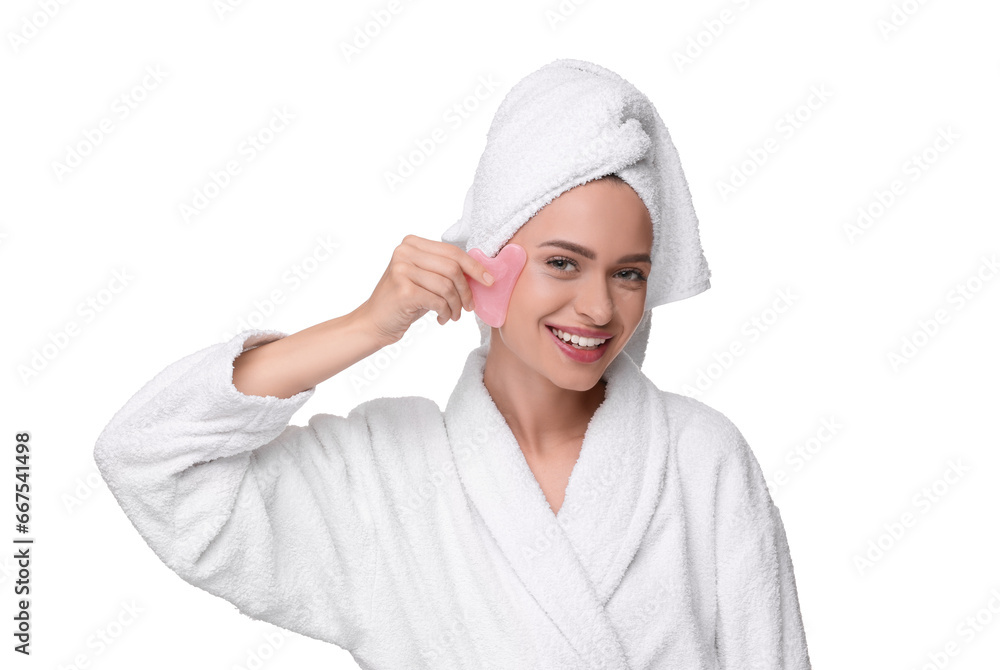 Young woman massaging her face with rose quartz gua sha tool isolated on white Young woman massaging her face with rose quartz gua sha tool isolated on white