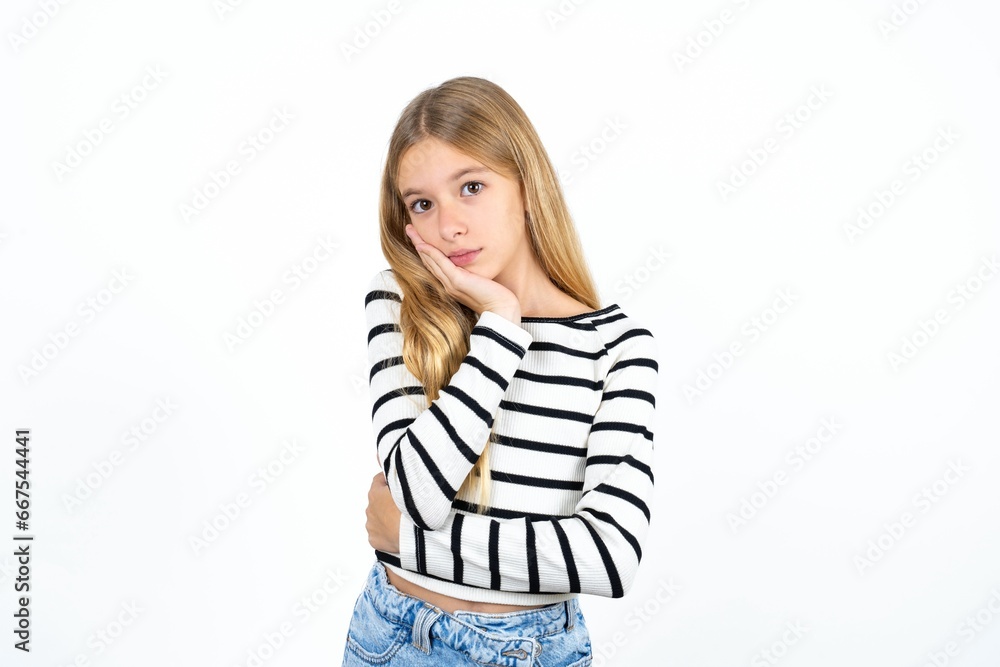 Very bored Beautiful teen girl holding hand on cheek while support it with another crossed hand, looking tired and sick, Very bored Beautiful teen girl holding hand on cheek while support it with another crossed hand, looking tired and sick,