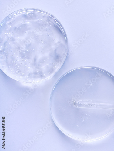 glass pipette serum gel closeup in petri dish on a light background
