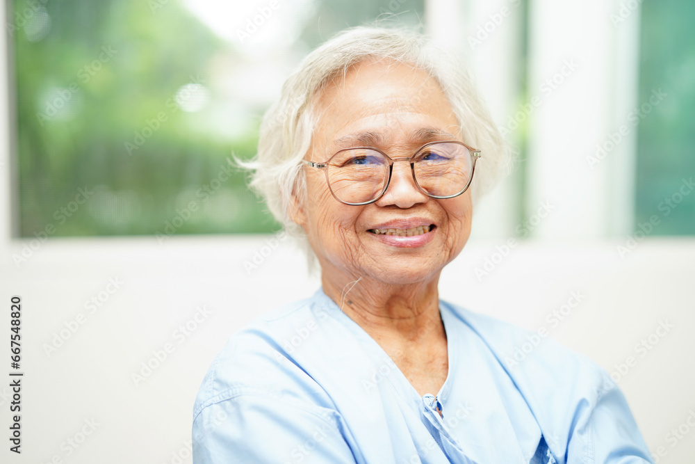 Asian senior woman wearing eyeglasses or vision glasses at home care service. Asian senior woman wearing eyeglasses or vision glasses at home care service.
