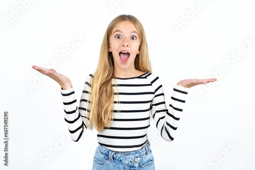 Beautiful caucasian teen girl wearing striped T-shirt celebrating crazy and amazed for success with arms raised and open eyes screaming excited. Winner concept photo