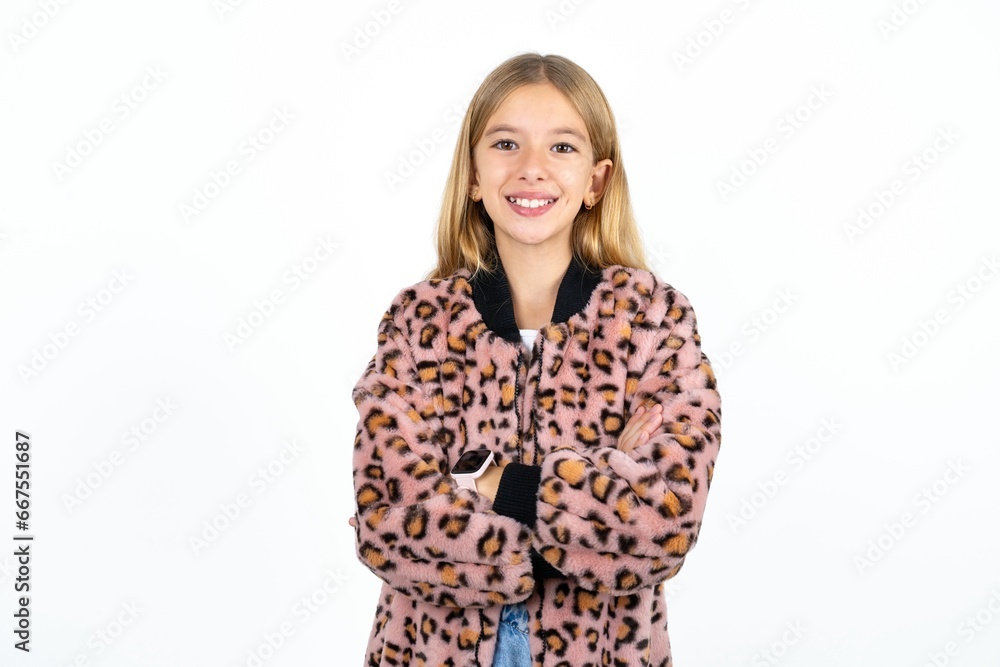 Portrait of charming Beautifu blonde kid girl standing confidently smiling toothily with hands folded Portrait of charming Beautifu blonde kid girl standing confidently smiling toothily with hands folded