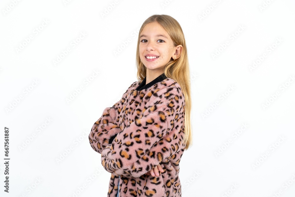 Portrait of Beautiful caucasian teen girl standing with folded arms and smiling Portrait of Beautiful caucasian teen girl standing with folded arms and smiling