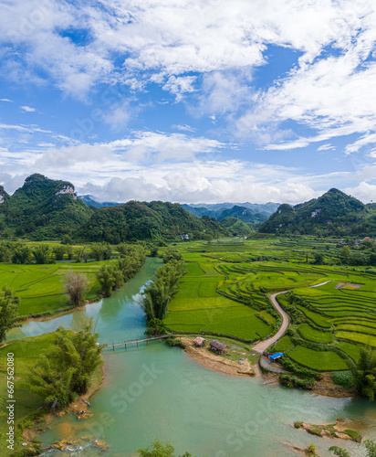 Aerial landscape in Quay Son river, Trung Khanh, Cao Bang, Vietnam with nature, green rice fields and rustic indigenous houses