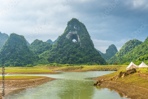 Aerial view of Thung mountain in Tra Linh, Cao Bang province, Vietnam with lake, cloudy, nature. photo