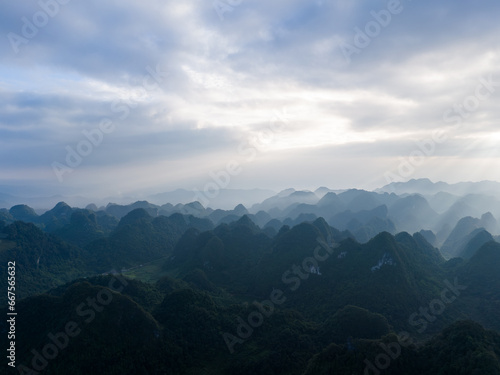 Aerial view of Thung mountain in Tra Linh  Cao Bang province  Vietnam with lake  cloudy  nature.