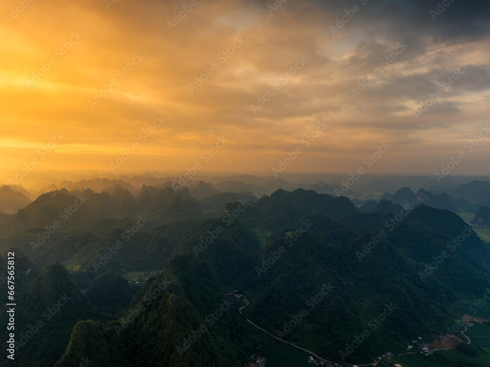 Aerial view of Thung mountain in Tra Linh, Cao Bang province, Vietnam with lake, cloudy, nature.