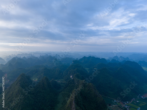 Aerial view of Thung mountain in Tra Linh, Cao Bang province, Vietnam with lake, cloudy, nature. © CravenA